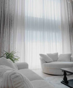 sheer white curtains bright summer living room