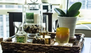 Organizing coffee table accessories in a woven tray introduces natural textures.