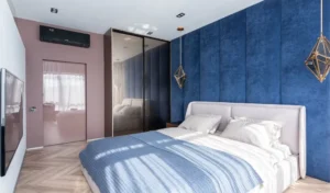 bedroom layout with sloped ceiling and low bed placement
