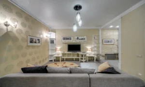 tv on a swivel stand positioned to the side of a living room seating area with no dedicated tv wall
