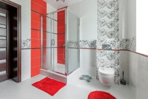 red bath mat white tile bathroom