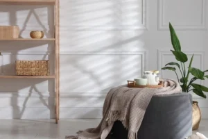 round ottoman used as a coffee table alternative in a small living room