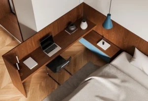 small bedroom with a compact desk tucked into a corner