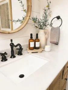 Amber glass soap dispenser and jar styled on a bathroom counter