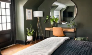 green accent wall bedroom with natural morning light