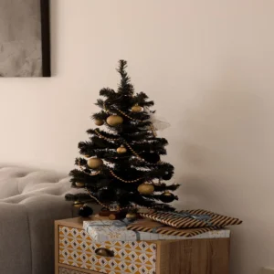 mini christmas tree on a dorm room desk