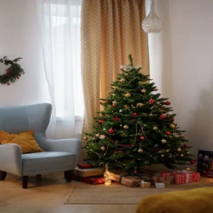 small christmas tree styled in a corner with gifts