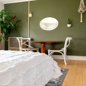 wood floor undertone next to green accent wall bedroom